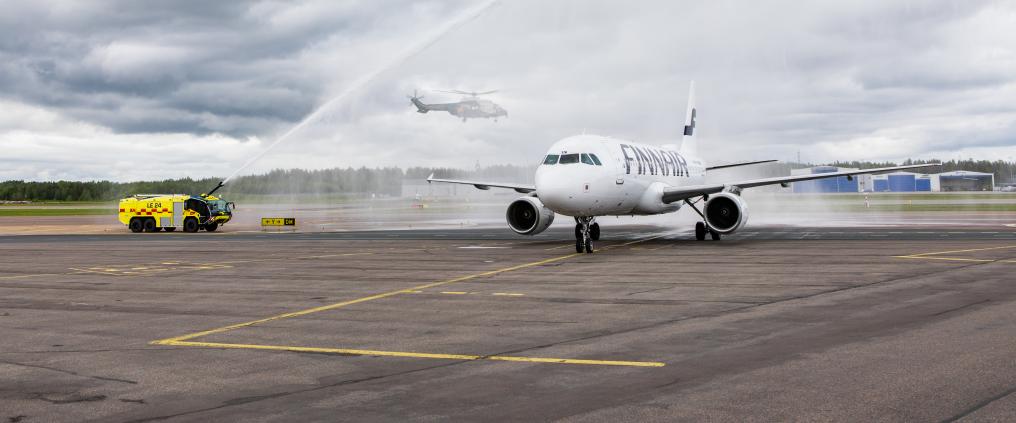 Finnair airplane receiving water salute.