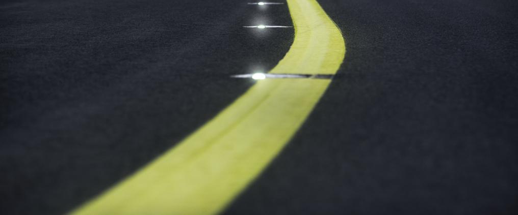 Yellow line on the runway at night.
