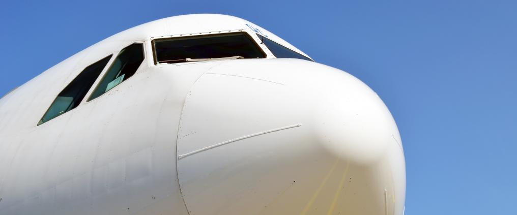 A close-up photo of a white airplane