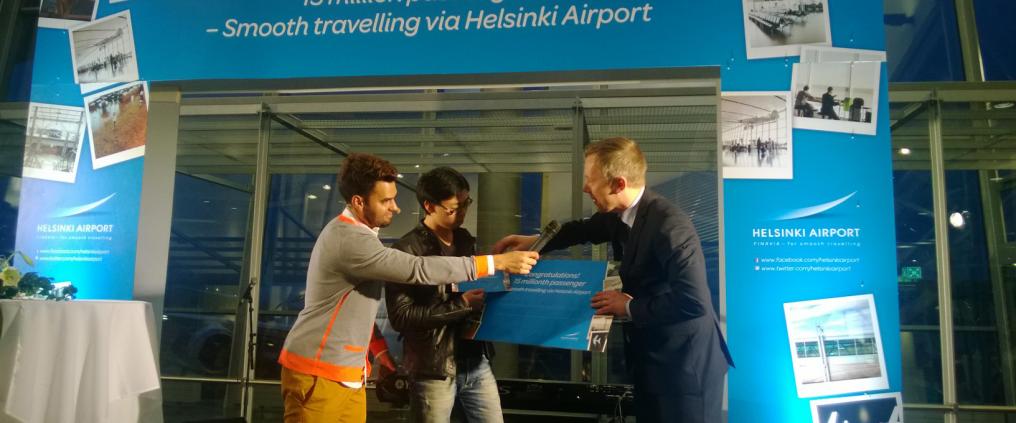 A person interviewing another at airport.