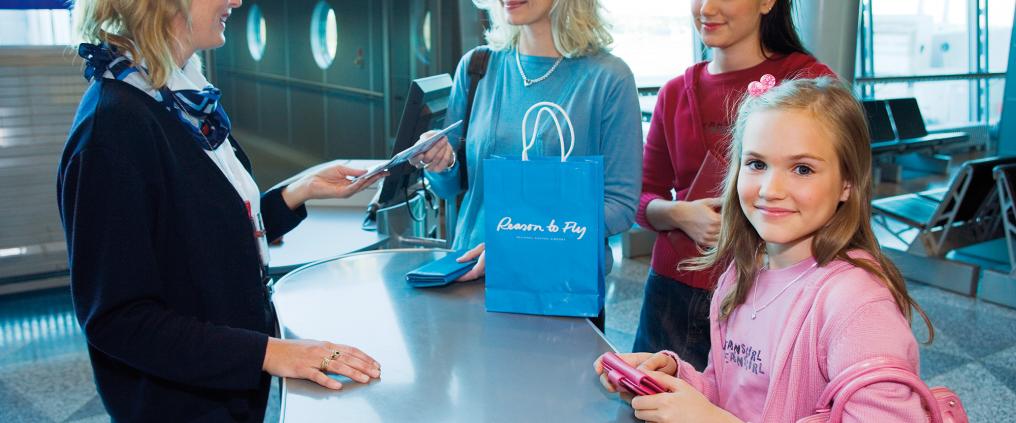 Family at boarding gate counter.