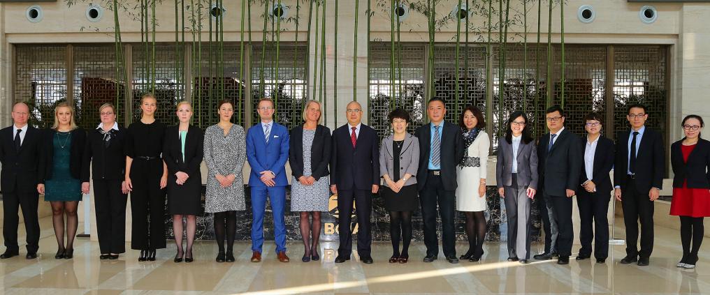 Finavia staff and  Beijing Capital International Airport staff standing together for a picture.