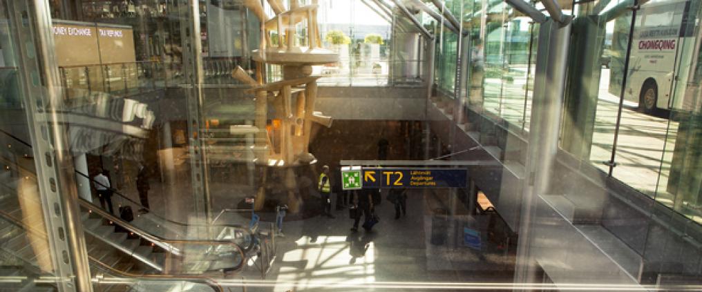People passing in airport corridors.