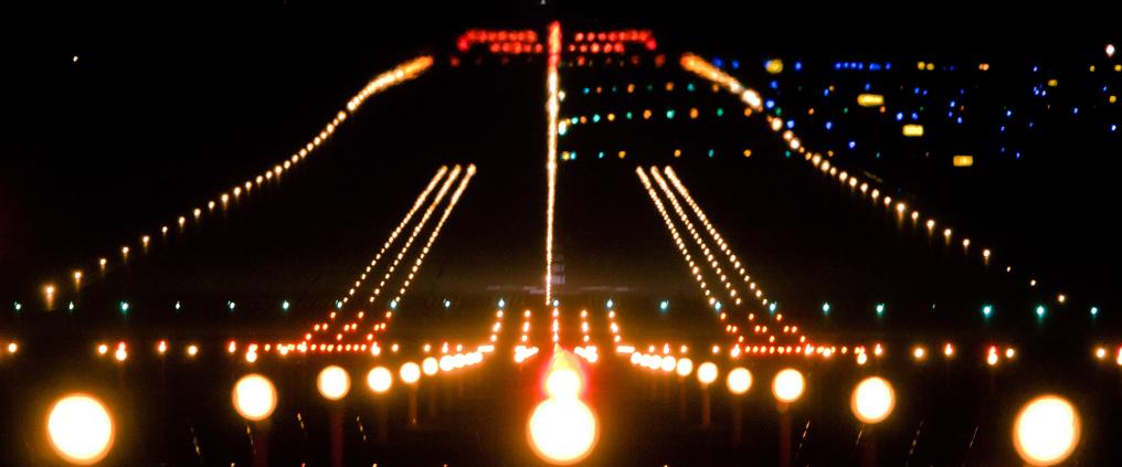 The runway lights during night.