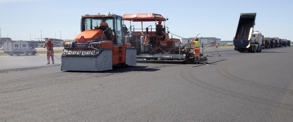 Asphalt machines at runway.