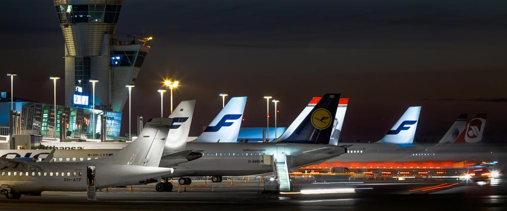 Airplanes at Helsinki Airport at night.