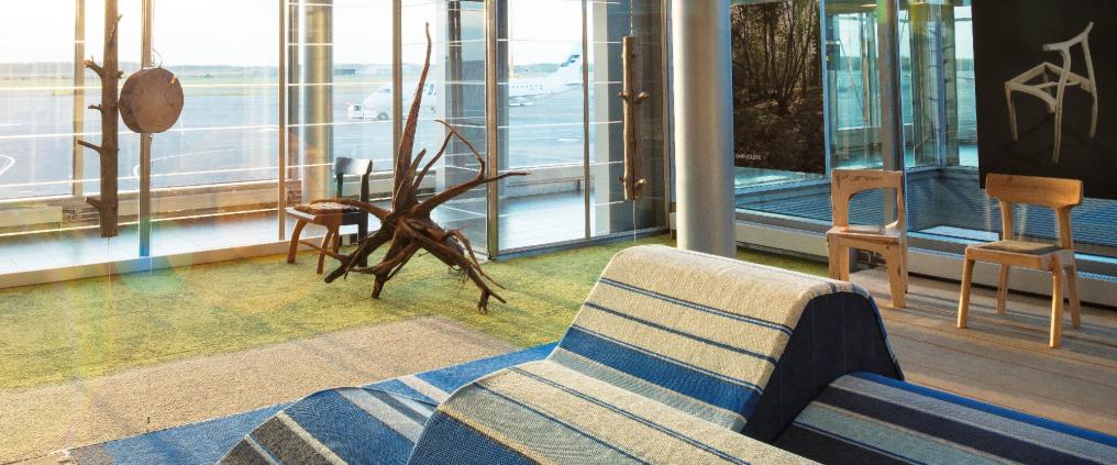 A lounge with wooden furniture.