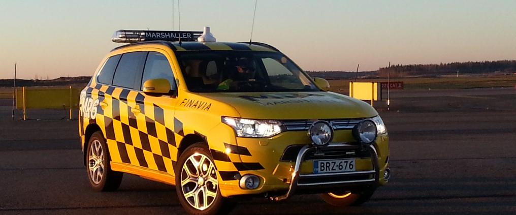 Yellow Mitsubisi Outlander car of Helsinki airport's marshallers.