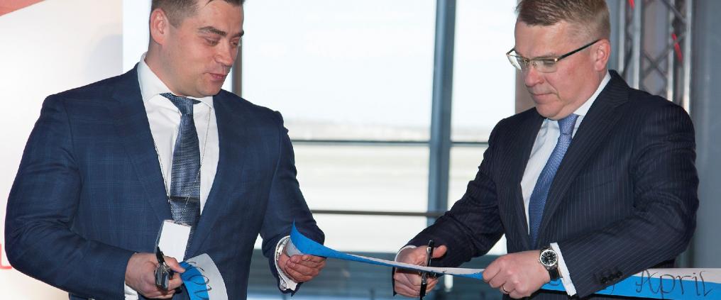 Two men at flight router opening ceremony.