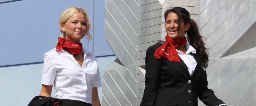 Two flight attendants walking.