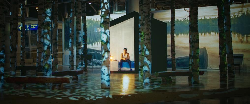 Man inside of cottage at Helsinki Airport.