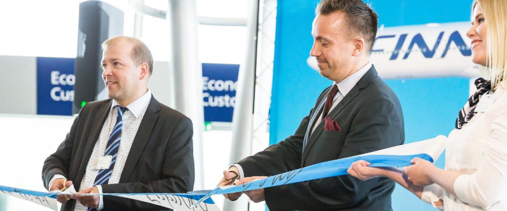 Ceremonial ribbon cutting during Fukuoka route opening ceremony at Helsinki Airport.