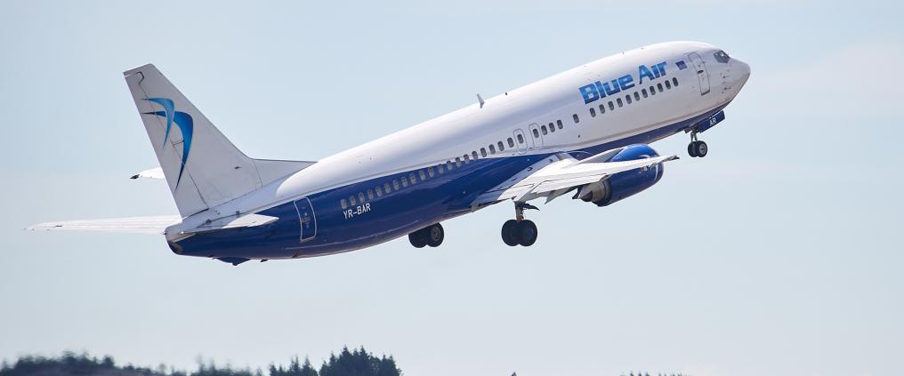 Blue Air airplane taking off.