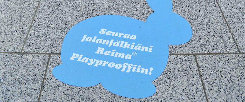 A blue rabbit shaped sign at the floor.