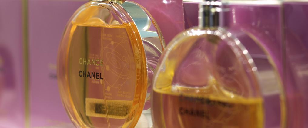 Perfume bottles on store shelf.