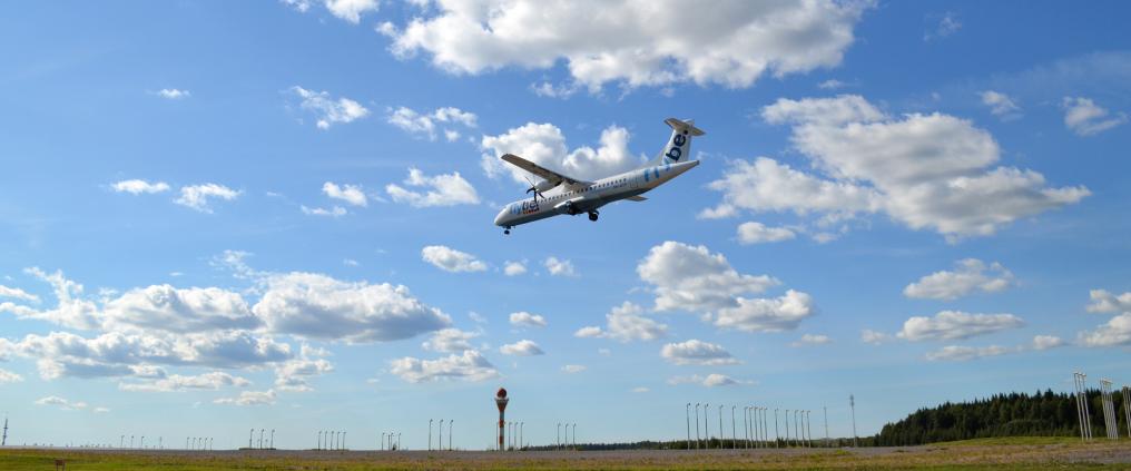 An airplane landing to runway.