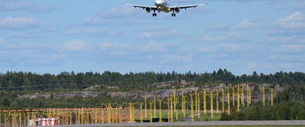 An airplane landing to runway.