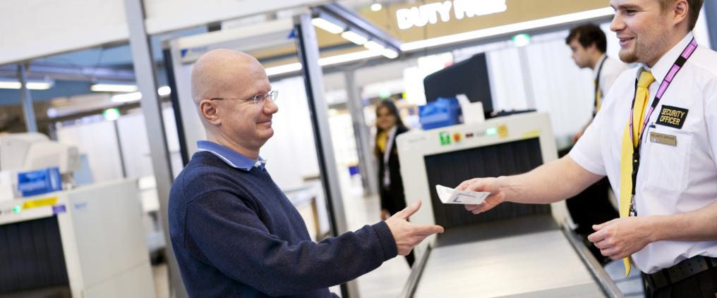A man at a secuty check.