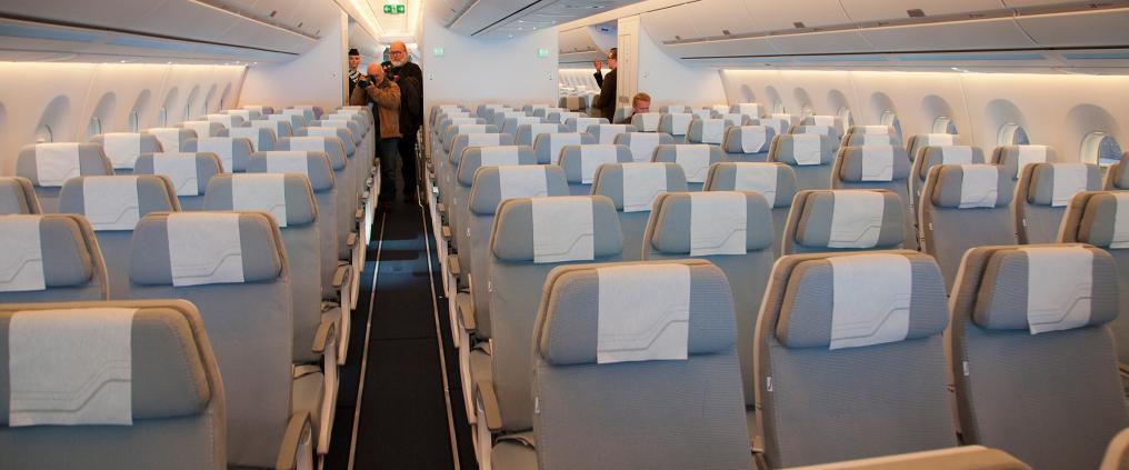 An empty cabin inside an airplane.