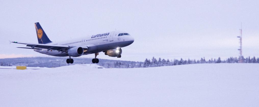 Lufthansa airplane taking off during winter.