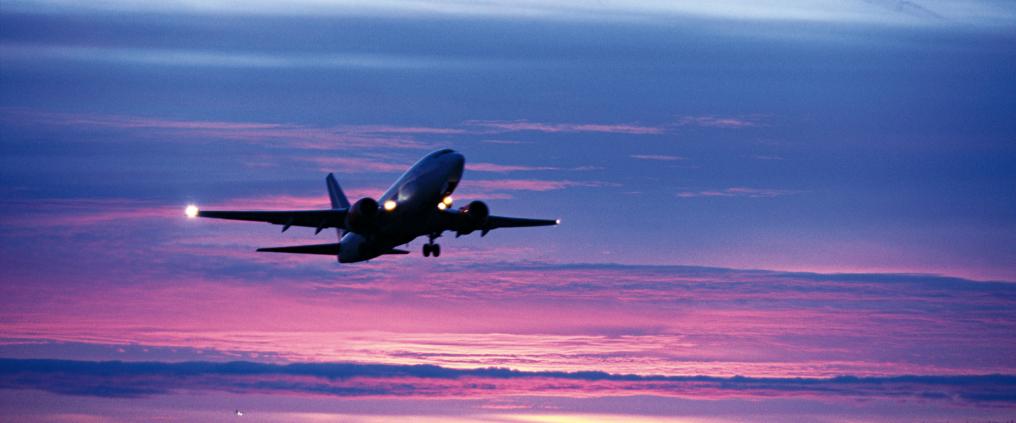 Airplane ascending into sky.