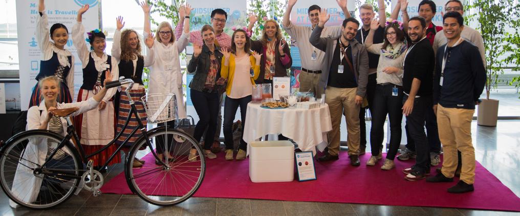 Multiple people smiling at camera.