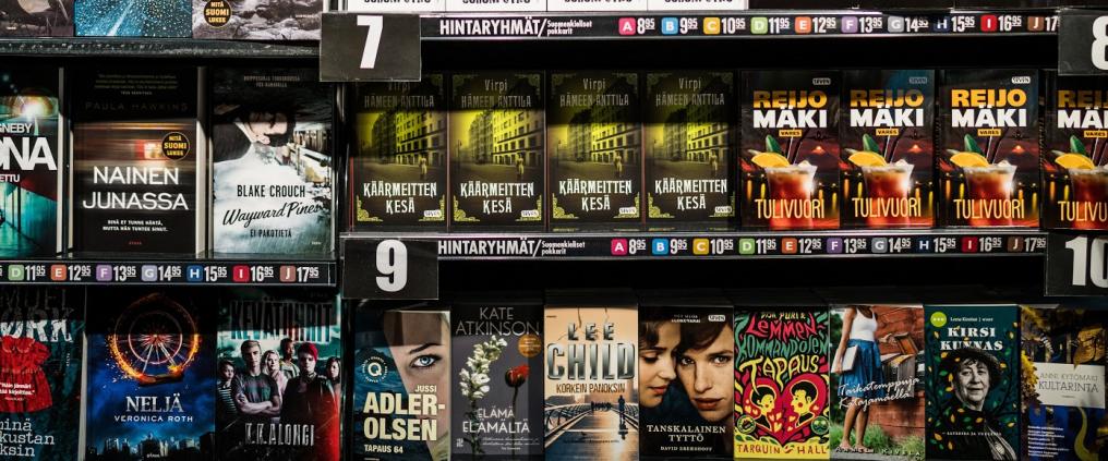 Multiple of books displayed on a shelf.