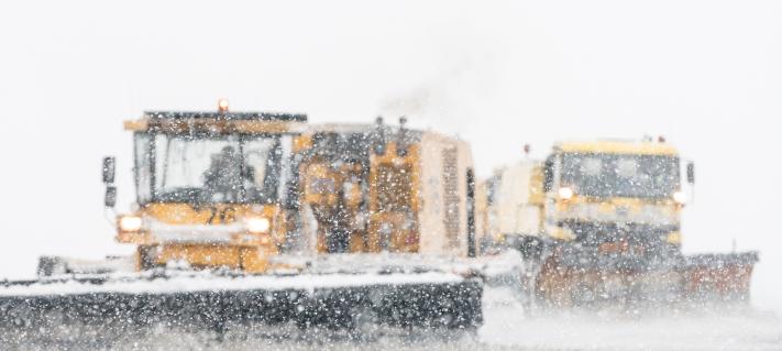 Cleaning snow on runway.